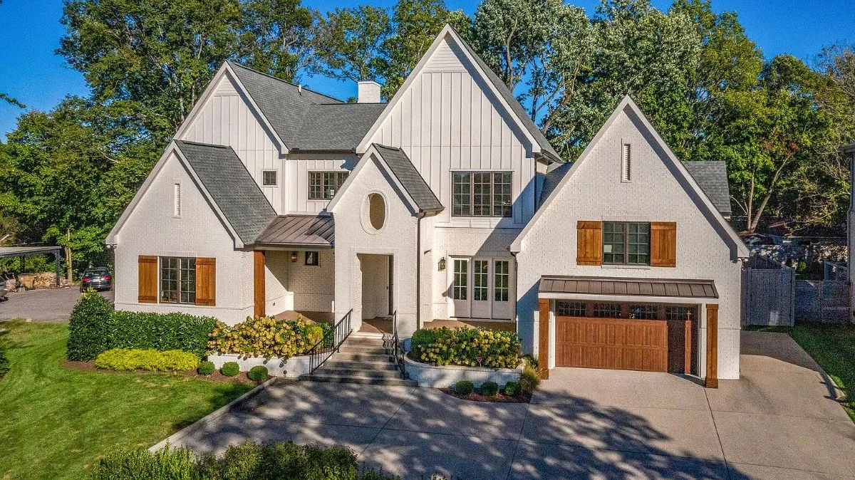 The front from above, with the courtyard drive and the two-car garage