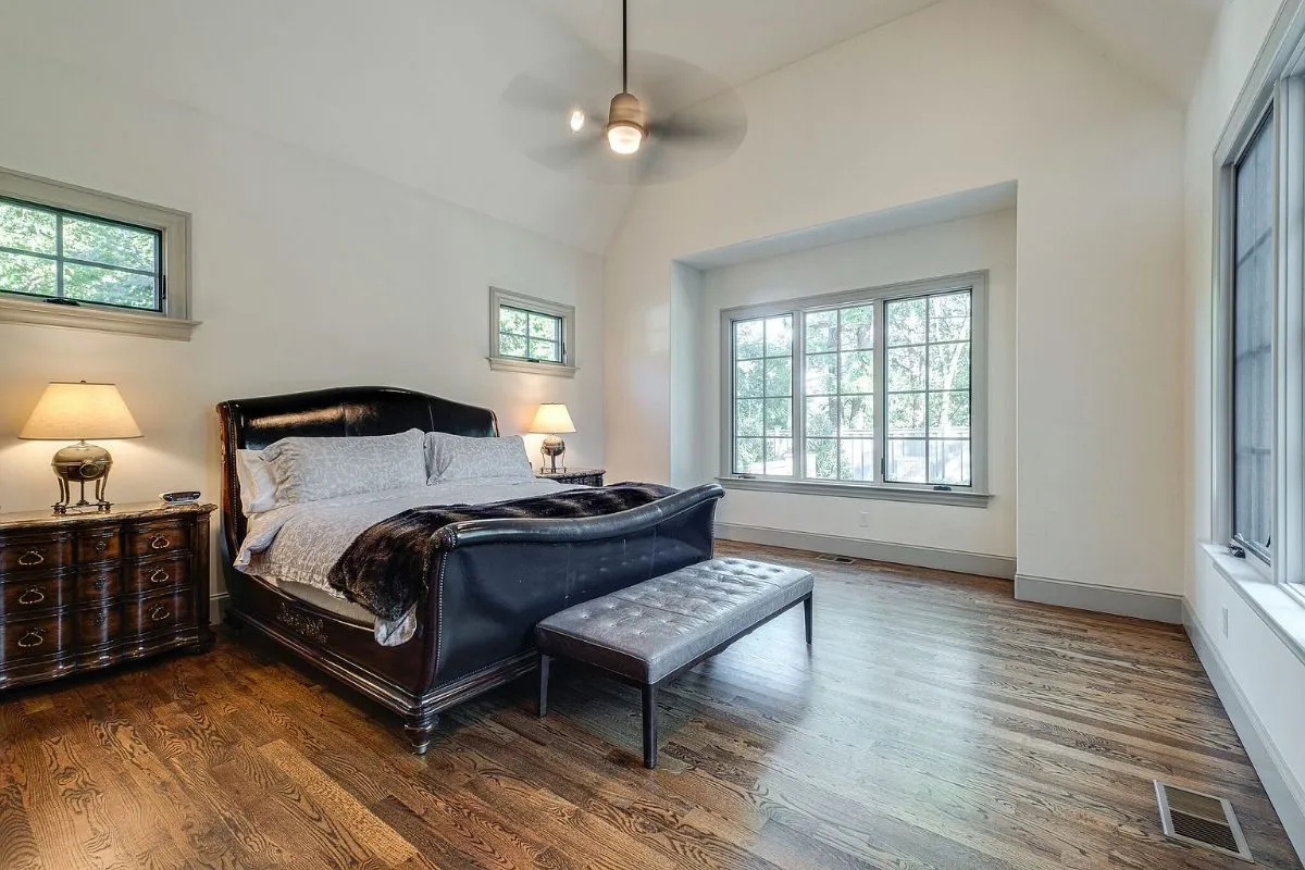 Primary bedroom under a vaulted ceiling