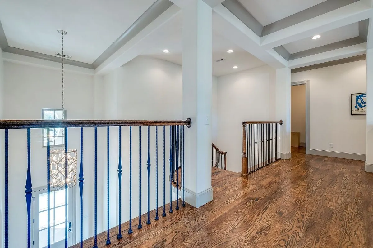 Upstairs landing overlooking the foyer chandelier