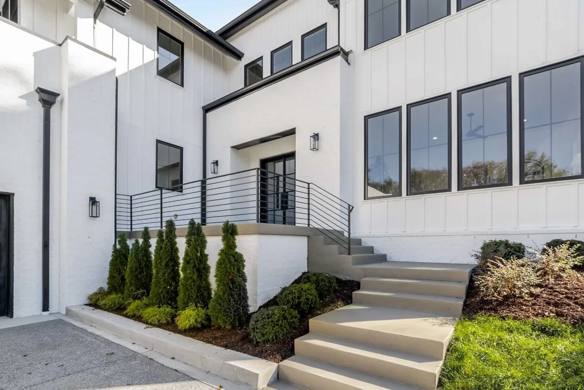 Front entry with a steel-rail stair and a covered porch