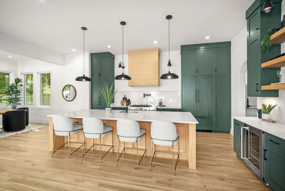 Kitchen with a white oak island and pendant lights