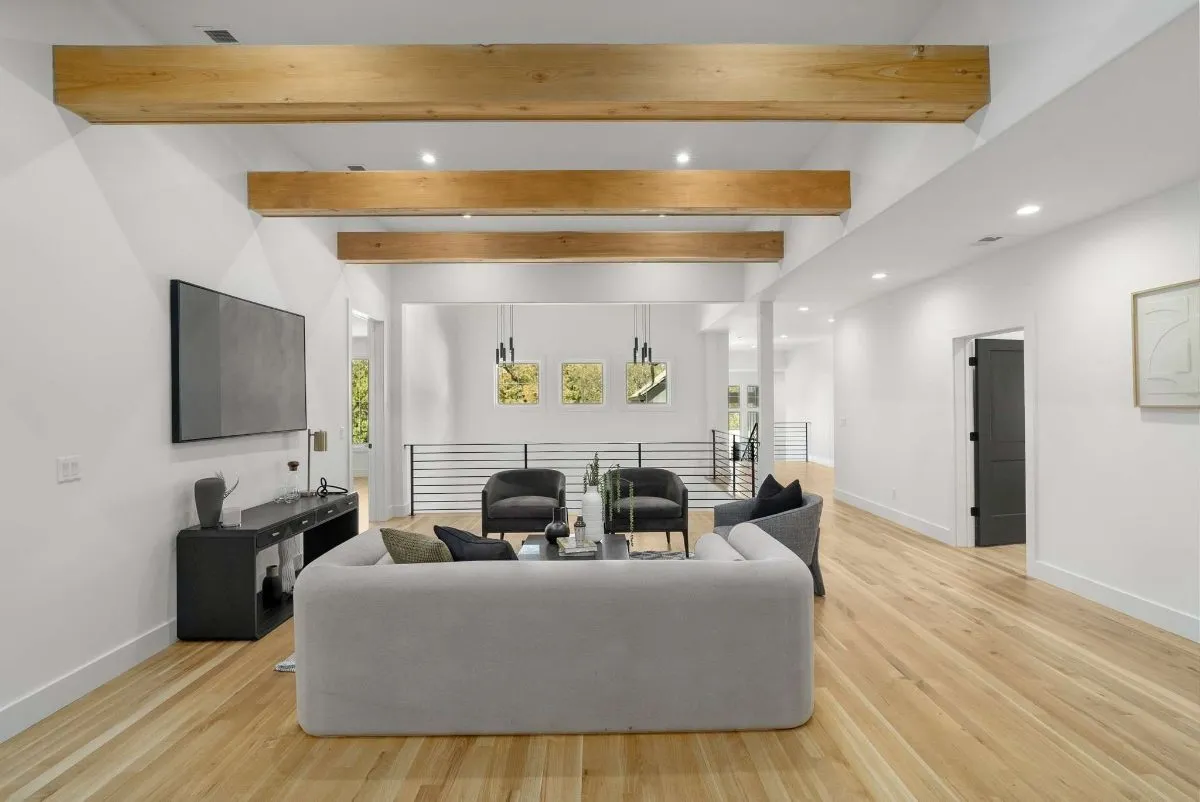 Upstairs living room under exposed beams
