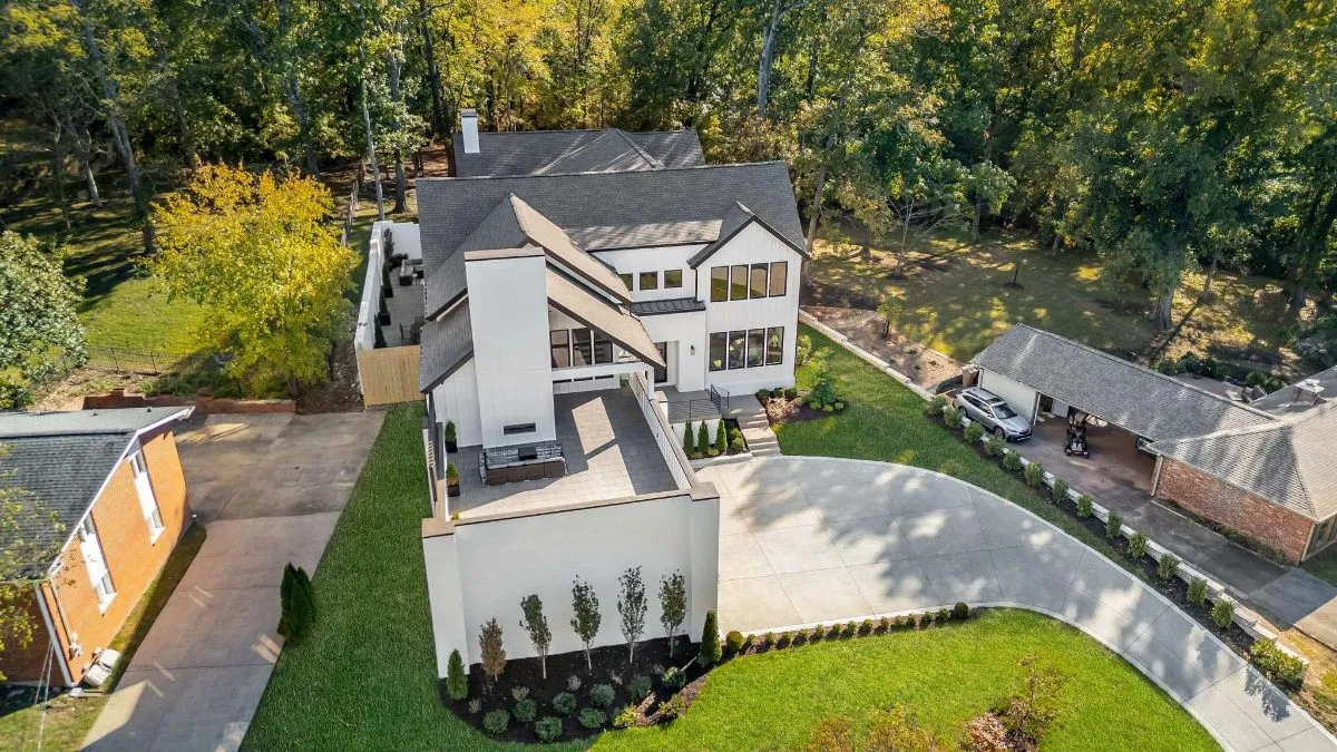 The home from above, with the backyard and trees